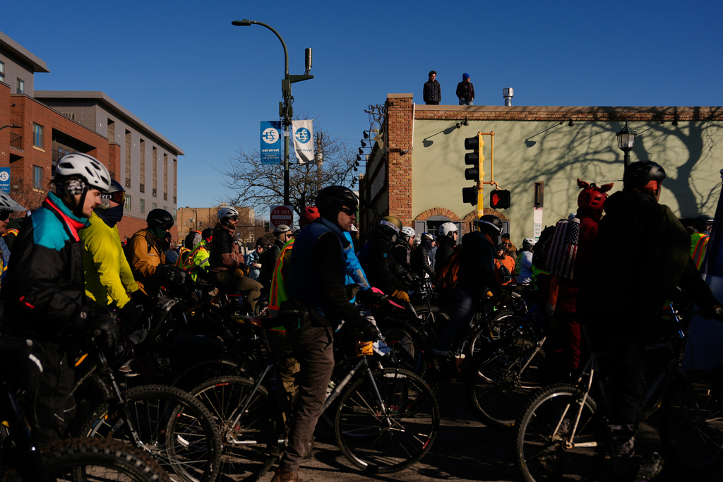 People gather for a solidarity bike ride for Alex Pretti and Renee Good on Saturday, Jan. 31, 2026 in Minneapolis. (AP Photo/Julia Demaree Nikhinson)