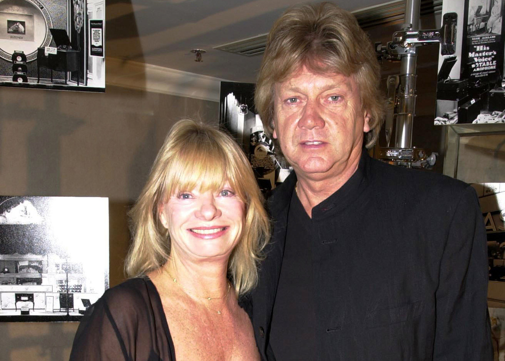 Moody Blues lead singer John Lodge and his wife arrive at the Grosvenor Hotel in London, Oct. 18, 2001. (Lionel Healing/PA via AP, file)