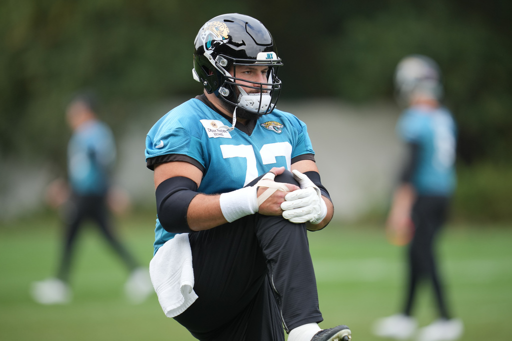Jacksonville Jaguars center Robert Hainsey (73), works out during an NFL football practice at The Grove in Watford, England, Friday, Oct. 17, 2025. (AP Photo/Kin Cheung)