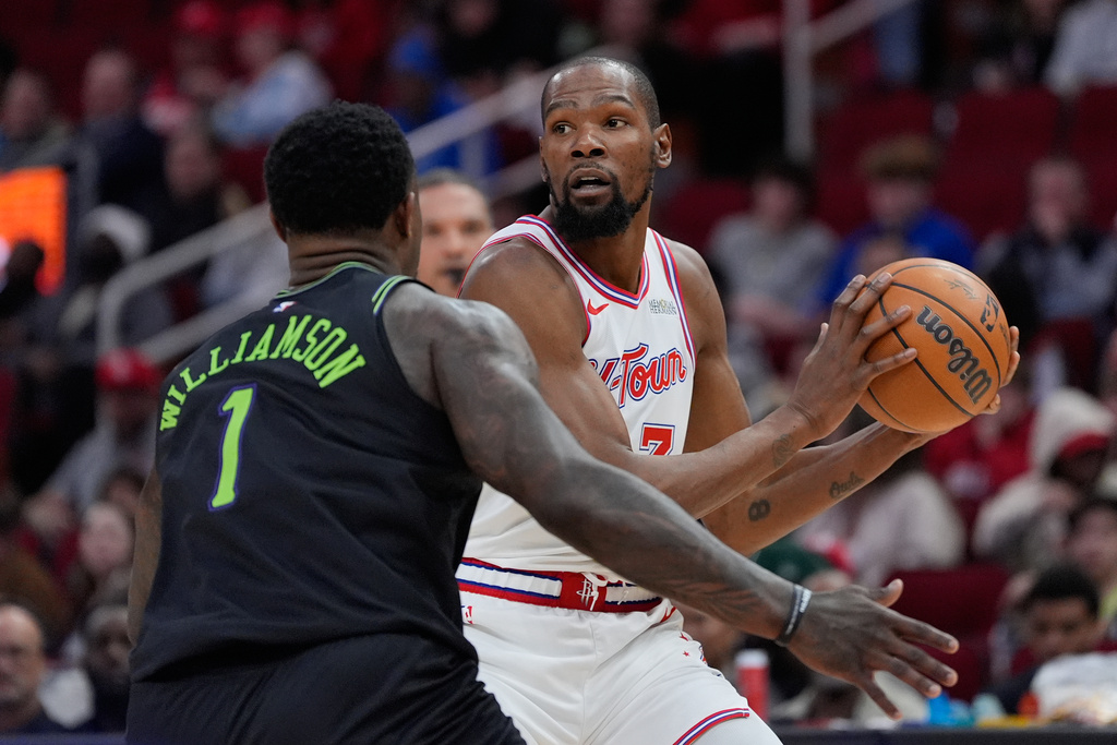 Houston Rockets forward Kevin Durant (7) controls the ball against New Orleans Pelicans forward Zion Williamson (1) during the second half of an NBA basketball game in Houston, Sunday, Jan. 18, 2026. (AP Photo/Ashley Landis)