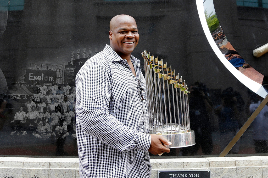 FILE - Former Chicago White Sox player and Hall of Famer Frank Thomas holds the 2005 World Series Champion trophy before a baseball game between the Kansas City Royals and the Chicago White Sox in Chicago, on July 18, 2015. (AP Photo/Nam Y. Huh, File)