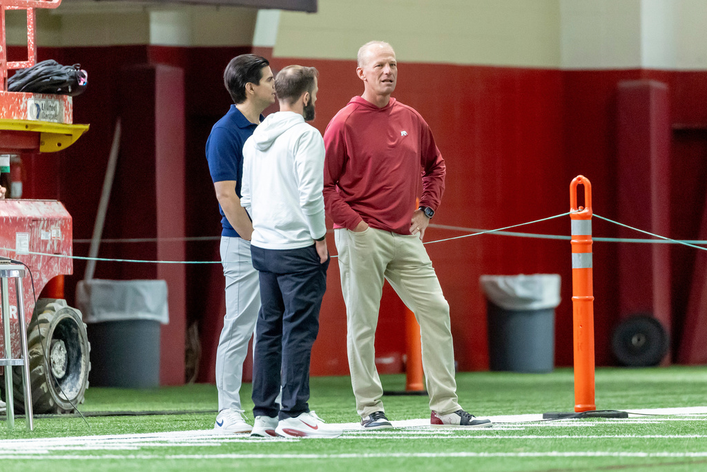Alabama head coach Kalen DeBoer, right, watches during Alabama's NFL football pro day, Wednesday, March 25, 2026, in Tuscaloosa, Ala. (AP Photo/Vasha Hunt)