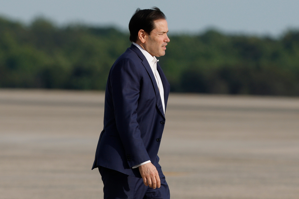 Secretary of State Marco Rubio departs Air Force One upon President Trump's arrival at Joint Base Andrews, Md., Friday, May 15, 2026. (AP Photo/Luis M. Alvarez)