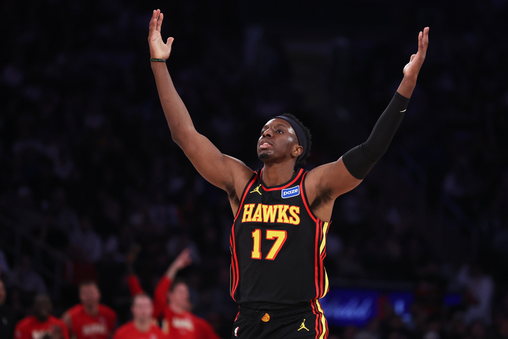 Atlanta Hawks forward Onyeka Okongwu reacts after scoring a 3-point basket during first half of an NBA basketball game against the New York Knicks, Friday, Jan. 2, 2026, in New York. (AP Photo/Heather Khalifa)