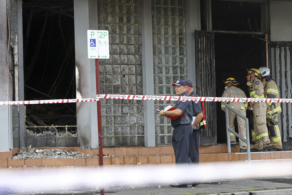 Fire crews and police at the scene of a fire at the Adass Israel Synagogue in Ripponlea, Melbourne, Australia, Dec. 6, 2024. (Con Chronis/AAP Image via AP)