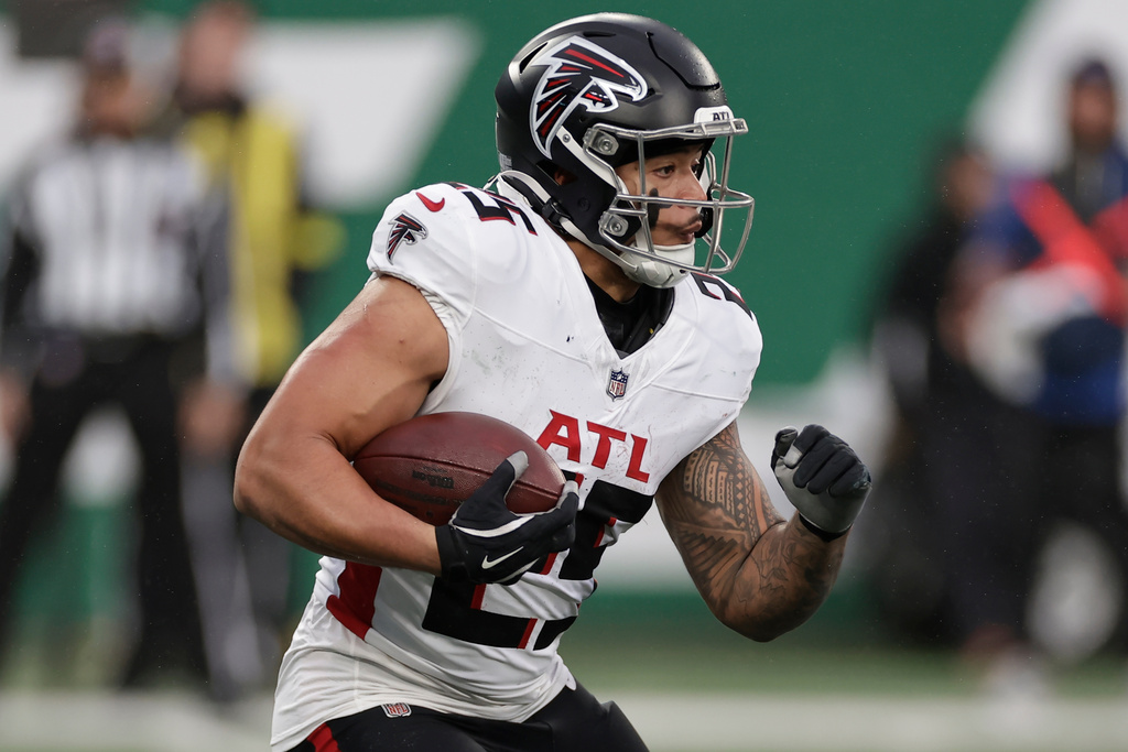 FILE - Atlanta Falcons running back Tyler Allgeier runs against the New York Jets during the second half of an NFL football game, Nov. 30, 2025, in East Rutherford, N.J. (AP Photo/Adam Hunger, file)