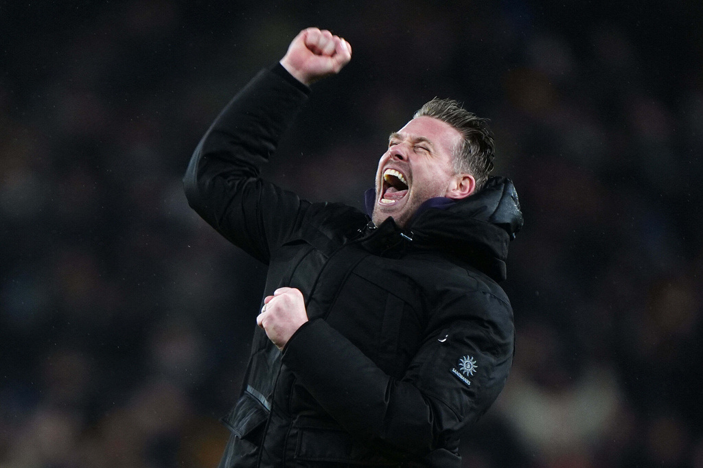 Wolverhampton Wanderers manager Rob Edwards celebrates their win after their English Premier League soccer match against Aston Villa in Wolverhampton, England, Friday, Feb. 27, 2026. (Bradley Collyer/PA via AP)