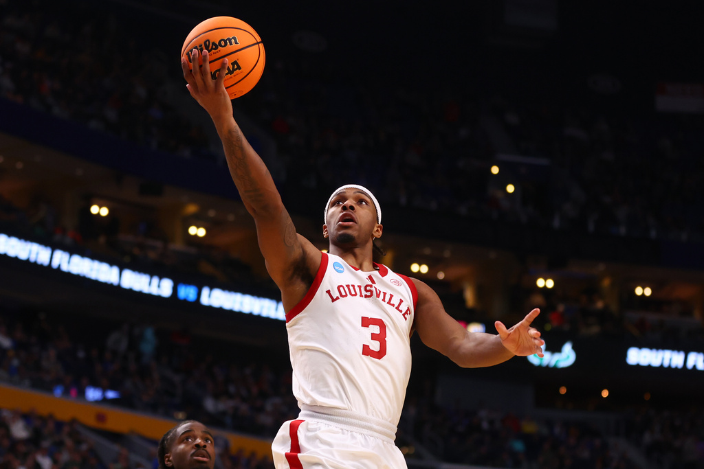 Louisville guard Ryan Conwell (3) goes up for a lay-up against South Florida during the second half in the first round of the NCAA college basketball tournament, Thursday, March 19, 2026, in Buffalo, N.Y. (AP Photo/Jeffrey T. Barnes)
