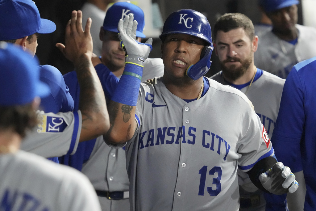 Kansas City Royals' Salvador Perez celebrates with teammates after hitting a solo home run during the fifth inning of a baseball game against the Chicago White Sox in Chicago, Wednesday, Aug. 27, 2025. (AP Photo/Nam Y. Huh)