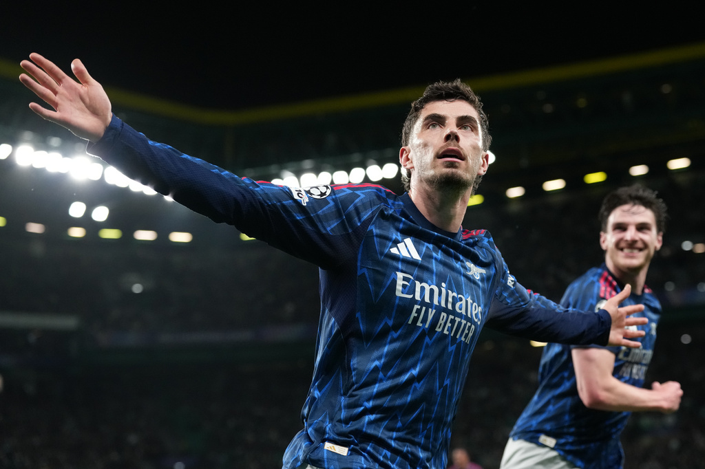 Arsenal's Kai Havertz celebrates after scoring his sides first goal during the Champions League quarterfinals, first leg, soccer match between Sporting CP and Arsenal, in Lisbon, Tuesday, April 7, 2026. (AP Photo/Armando Franca)