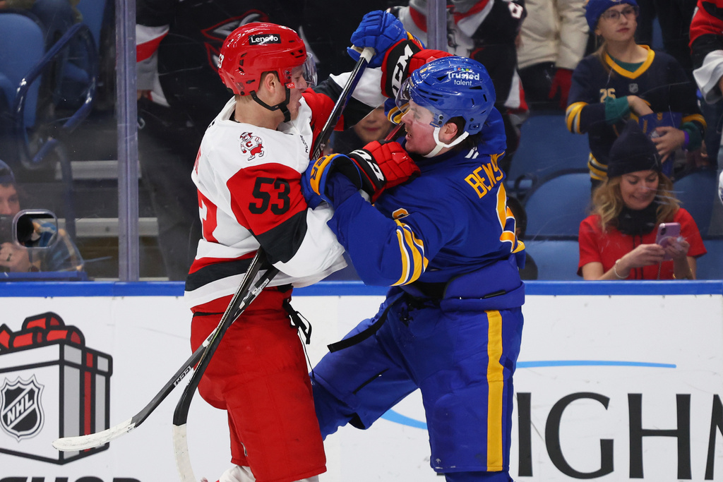 Carolina Hurricanes right wing Jackson Blake (53) and Buffalo Sabres left wing Zach Benson (6) collide during the second period of an NHL hockey game, Sunday, Nov. 23, 2025, in Buffalo, N.Y. (AP Photo/Jeffrey T. Barnes)