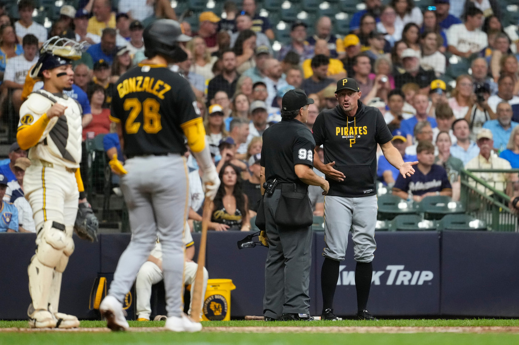 Pittsburgh Pirates manager Don Kelly argues with umpire James Hoye (92) during the fifth inning of a baseball game against the Milwaukee Brewers, Tuesday, Aug. 4, 2026, in Milwaukee. (AP Photo/Aaron Gash)