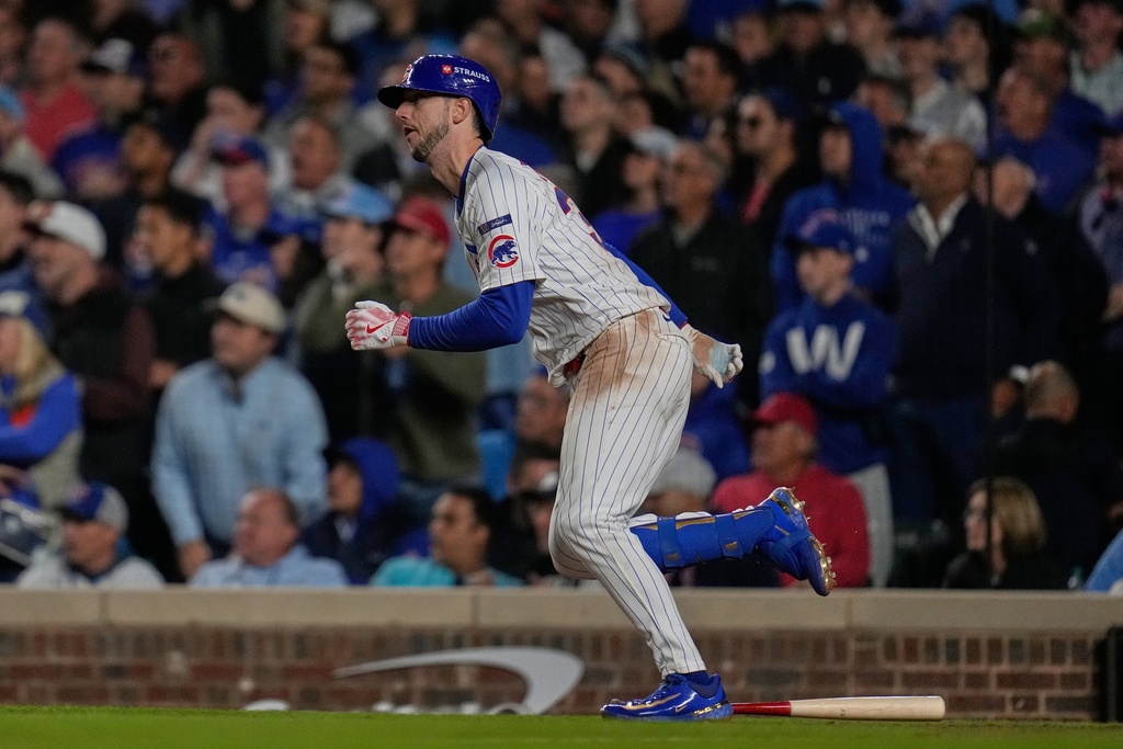 Chicago Cubs' Kyle Tucker hits a single during the seventh inning of Game 3 of baseball's National League Division Series against the Milwaukee Brewers Wednesday, Oct. 8, 2025, in Chicago. (AP Photo/Erin Hooley)