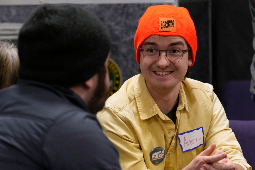 Avery Seuter talks with a fellow supporter of US Senate candidate Graham Platner during a Platner-themed trivia night, Thursday, March 26, 2027, in Kittery, Maine. (AP Photo/Robert F. Bukaty)