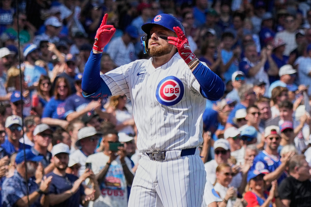 Chicago Cubs' Michael Busch celebrates as he rounds the bases after hitting a solo home run during the first inning of a baseball game against the Pittsburgh Pirates in Chicago, Saturday, Sept. 12, 2026. (AP Photo/Nam Y. Huh)