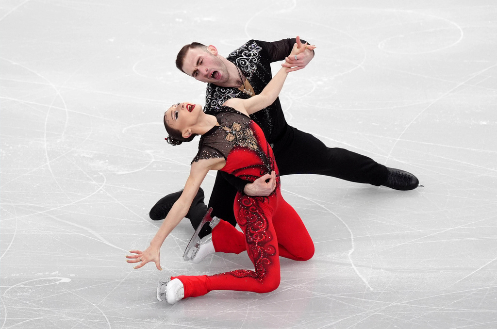 Georgia's Anastasiia Metelkina and Luka Berulava compete during the Pairs Short Program on day one of the ISU European Figure Skating Championships in Sheffield, England, Wednesday, Jan. 14, 2026. (Mike Egerton/PA via AP)