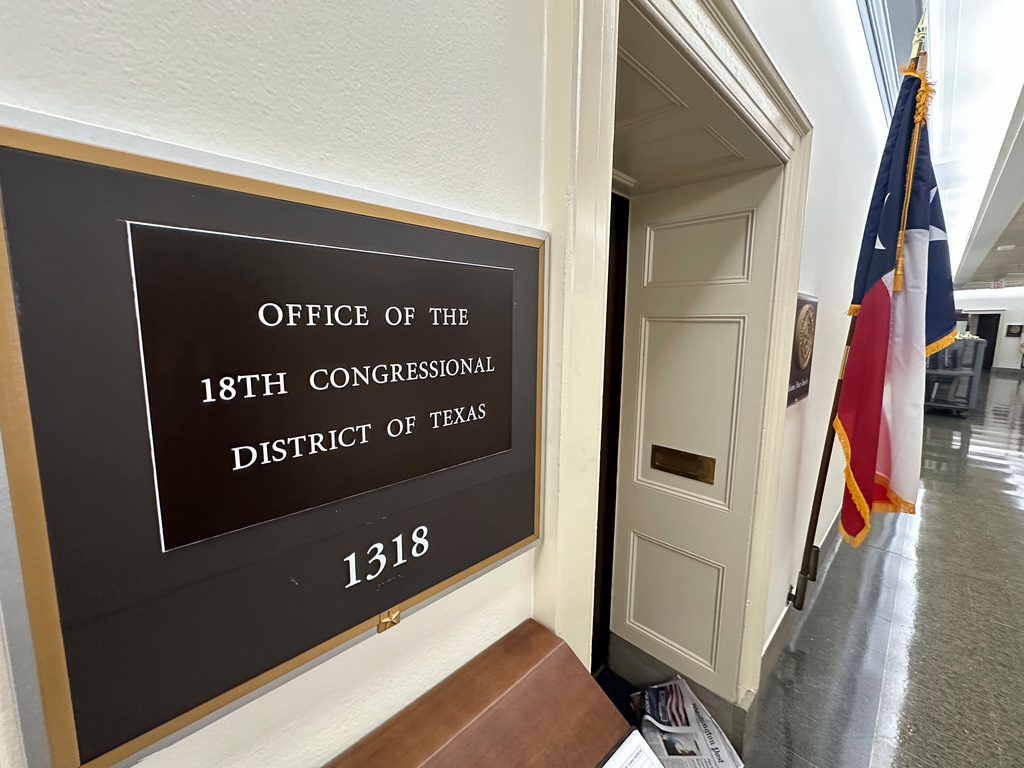 FILE - A Texas flag is on display outside the office of the state's 18th Congressional District, Sept. 2, 2025. (AP Photo/Robert Yoon, file)