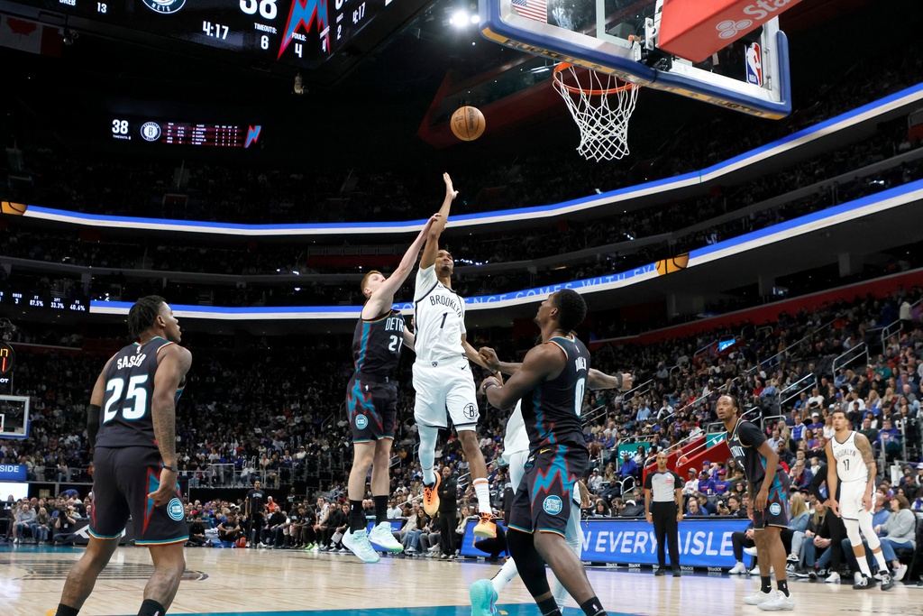 Brooklyn Nets forward Ziaire Williams (1) gets past Detroit Pistons guard Kevin Huerter (27) for a shot during the first half of an NBA basketball game Saturday, March 7, 2026, in Detroit. (AP Photo/Duane Burleson)