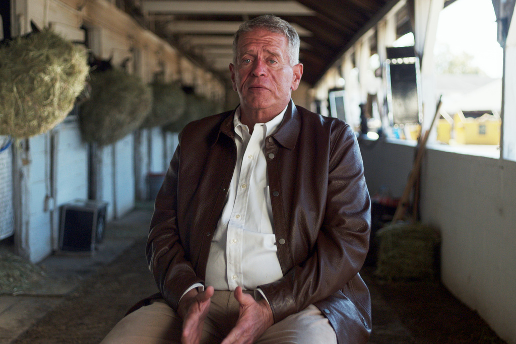 This photo provided by Dale Romans for Kentucky shows Dale Romans, a longtime thoroughbred trainer running as a Democrat for the U.S. Senate in Kentucky, at Churchill Downs, Oct. 2025, in Louisville, Ky. (Devin Tusa/Dale Romans for Kentucky via AP)