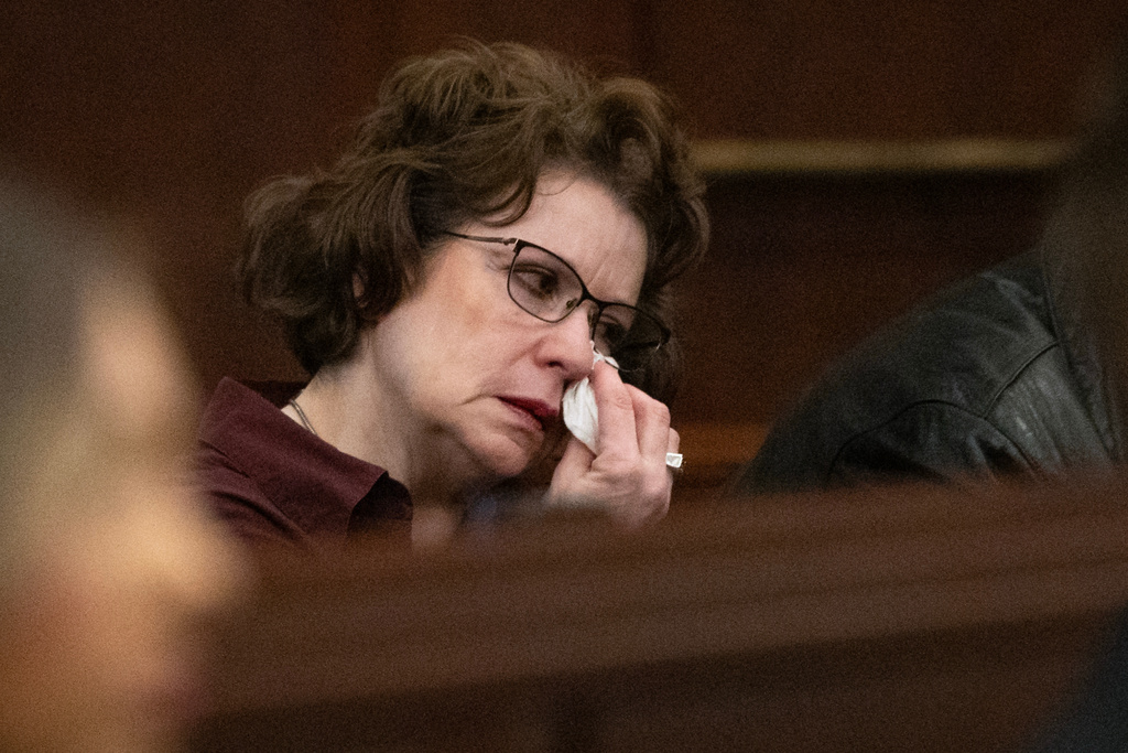 Elise Thompson wipes away tears in court in Raleigh, N.C., on Friday, Feb. 13, 2026, as Wake County Superior Court Judge Paul C. Ridgeway describes the actions of her son, Austin Thompson. (Scott Sharpe/The News & Observer via AP, Pool)