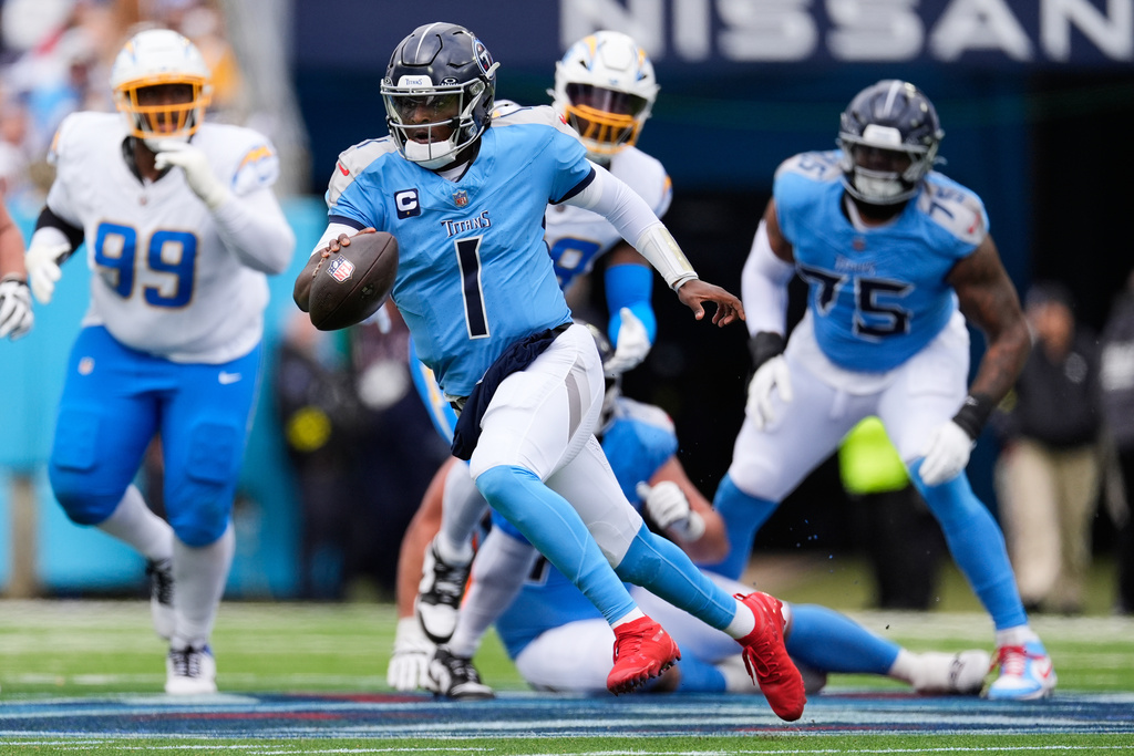 Tennessee Titans quarterback Cam Ward (1) runs during the first half of an NFL football game against the Los Angeles Chargers, Sunday, Nov. 2, 2025, in Nashville, Tenn. (AP Photo/George Walker IV)