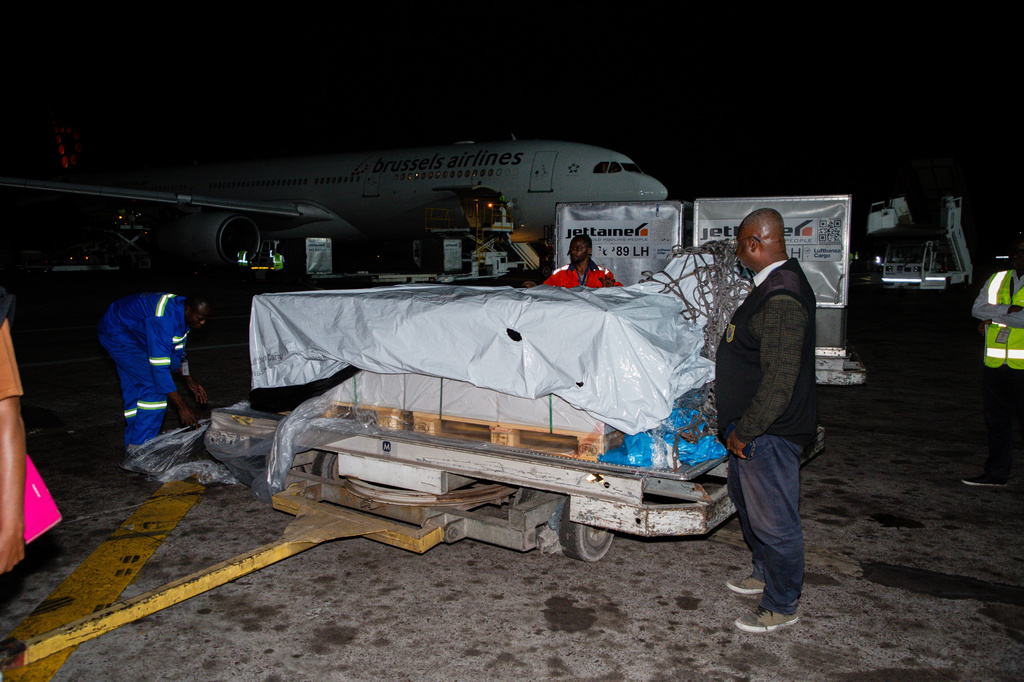 In this photo released by UNICEF, workers unload doses of Ebola (Zaire) vaccines from a plane at Ndjili International Airport in Kinshasa, Congo, Friday, Aug. 21, 2026. (Ndomba Mbikayi/UNICEF via AP)