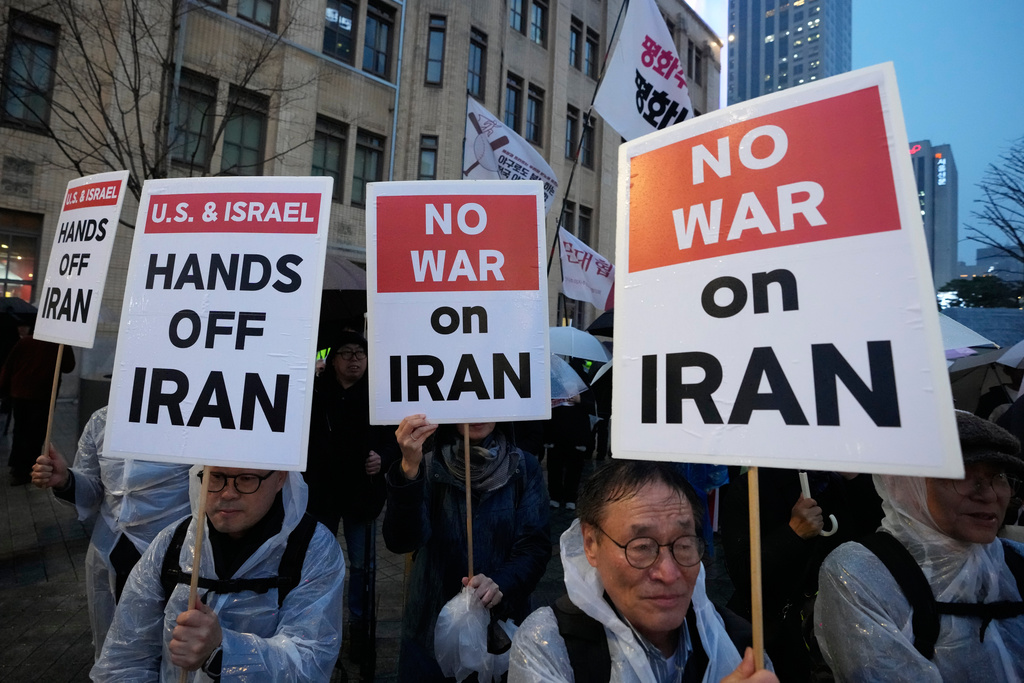South Korean protesters march toward the U.S. embassy during a rally denouncing the US and Israel's attack on Iran, in Seoul, South Korea, Thursday, March 5, 2026. (AP Photo/Ahn Young-joon)
