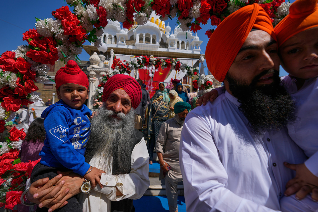 Sikh pilgrims attend a ceremony to celebrate Vaisakhi festival, which also marks the New Year in Sikh tradition, at the shrine of Gurdwara Panja Sahib in Hassan Abdal, Pakistan, Tuesday, April 14, 2026. (AP Photo/Anjum Naveed)