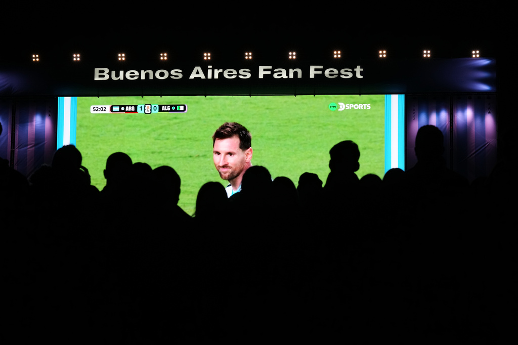 FILE - Fans watch Argentina's Lionel Messi on a giant screen during the World Cup soccer match between Argentina and Algeria in Buenos Aires, June 16, 2026.. (AP Photo/Rodrigo Abd, File)