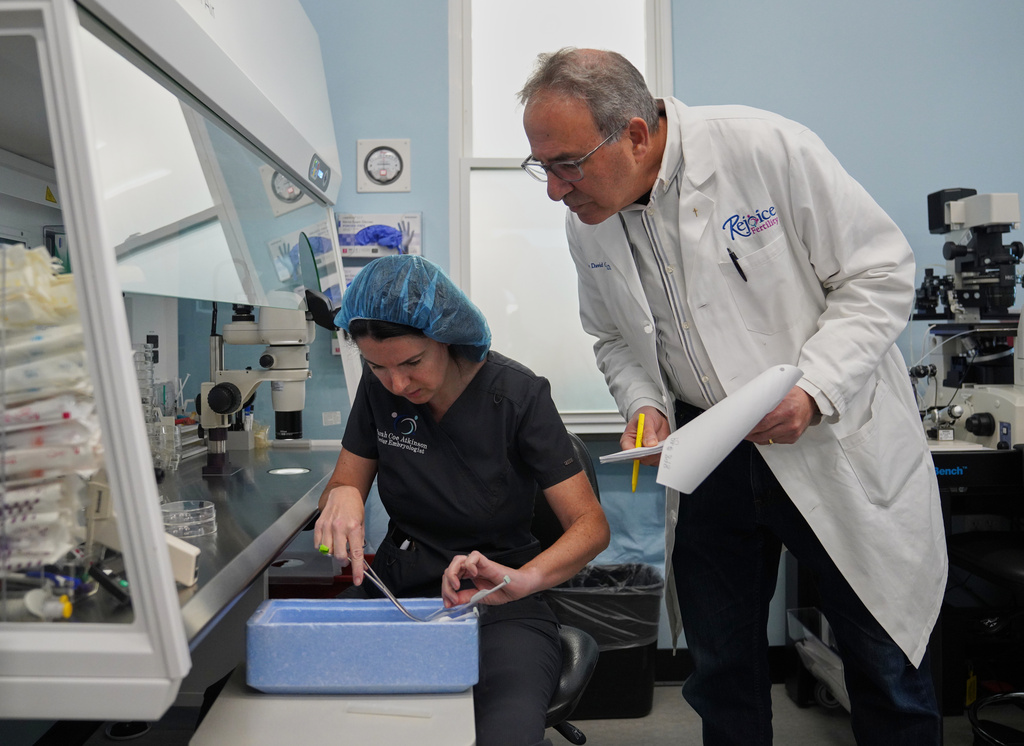 Sarah Atkinson, left, and Dr. John Gordon verify patient information while prepping a frozen embryo for transfer at Rejoice Fertility, Jan. 11, 2026, in Knoxville, Tenn. (AP Photo/Jessie Wardarski)