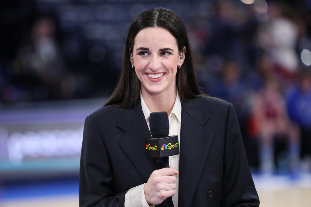 Indiana Fever guard Caitlin Clark participates in an NBC Sports broadcast before an NBA basketball game between the New York Knicks and the Oklahoma City Thunder, Sunday, March 29, 2026, in Oklahoma City. (AP Photo/Nate Billings)