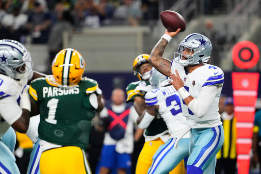 Dallas Cowboys quarterback Dak Prescott (4) throws a pass under pressure from Green Bay Packers defensive end Micah Parsons (1) in the first half of an NFL football game Sunday, Sept. 28, 2025, in Arlington, Texas. (AP Photo/Jeffrey McWhorter) Dallas Cowboys quarterback Dak Prescott (4) throws a pass under pressure from Green Bay Packers defensive end Micah Parsons (1) in the first half of an NFL football game Sunday, Sept. 28, 2025, in Arlington, Texas. (AP Photo/Jeffrey McWhorter)