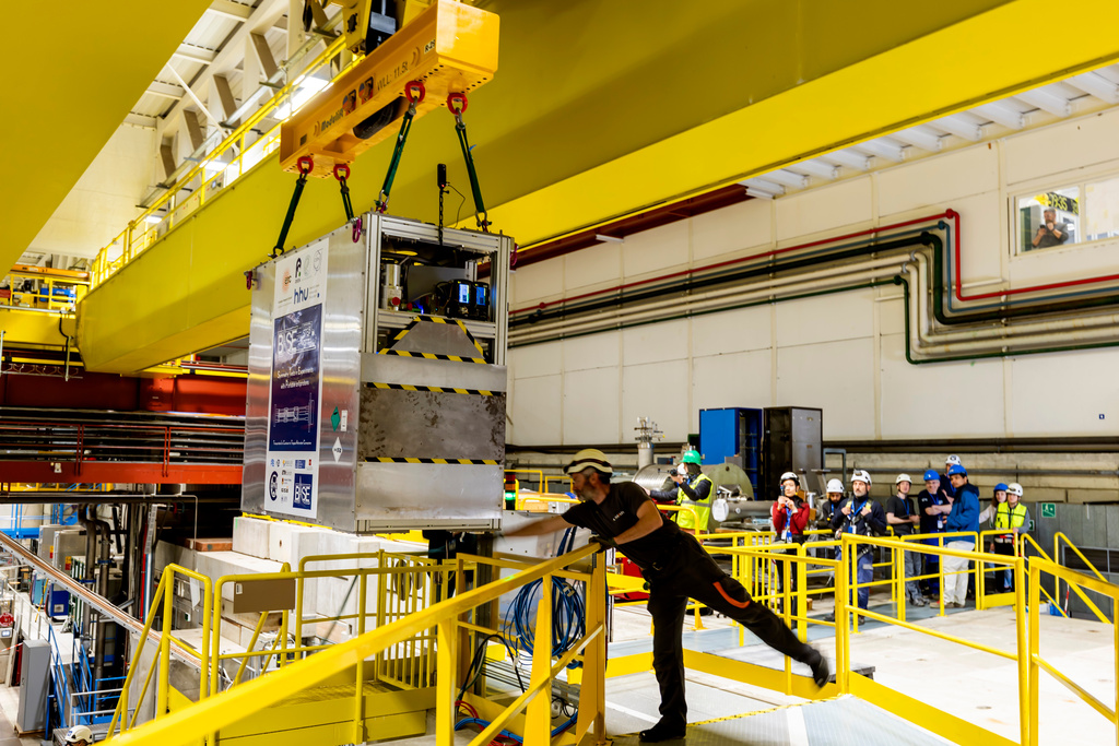 Technicians move the transportable antimatter trap into the Antimatter Factory at the European Organization for Nuclear Research (CERN) for a road test in Meyrin near Geneva, Switzerland, Tuesday, March 24, 2026. (Salvatore Di Nolfi/Keystone via AP)