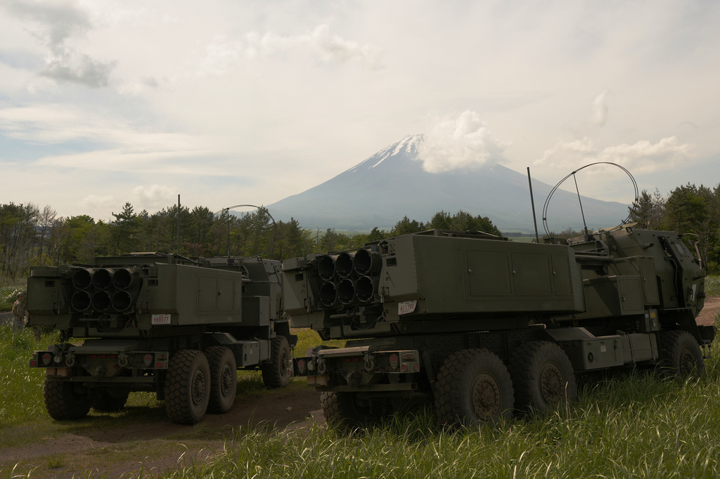 U.S. Marines show the High Mobility Artillery Rocket System (HIMARS) mounted on trucks during a media tour after they conducted its live-fire training at Camp Fuji, in Gotemba, southwest of Tokyo, Wednesday, May 20, 2026, as Mount Fuji is seen behind clouds. (AP Photo/Hiro Komae)