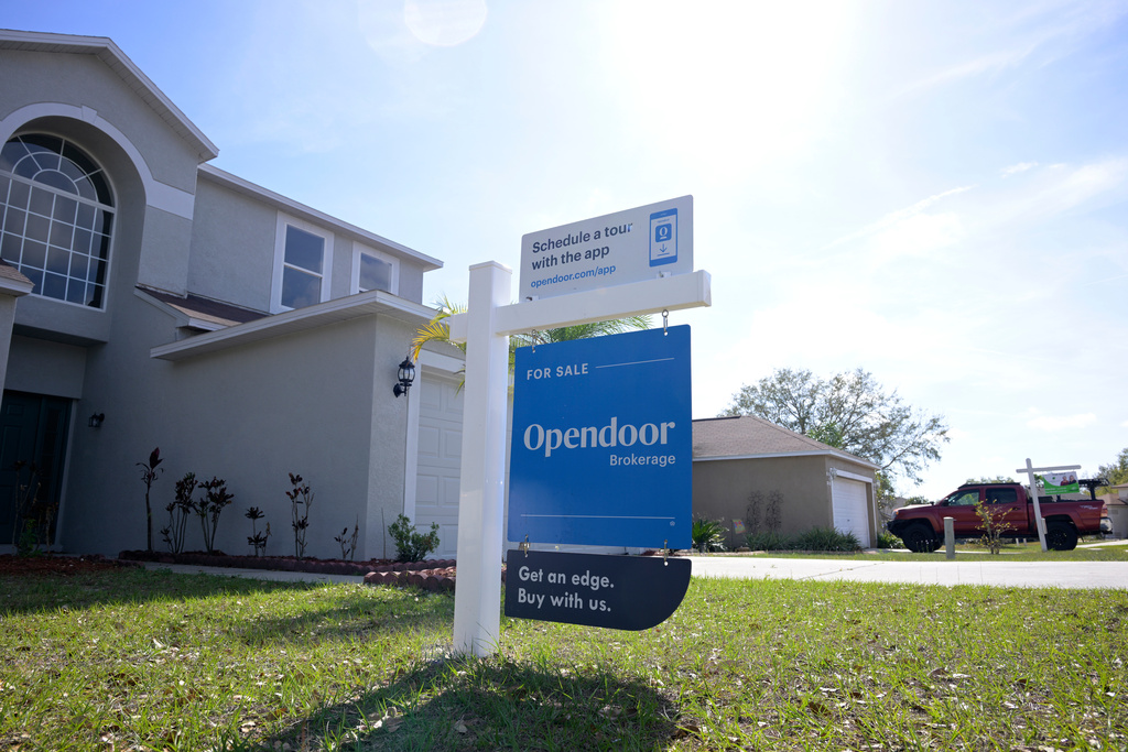 FILE - Real estate signs are posted outside homes for sale, Feb. 21, 2023, in Valrico, Fla. (AP Photo/Phelan M. Ebenhack, File)