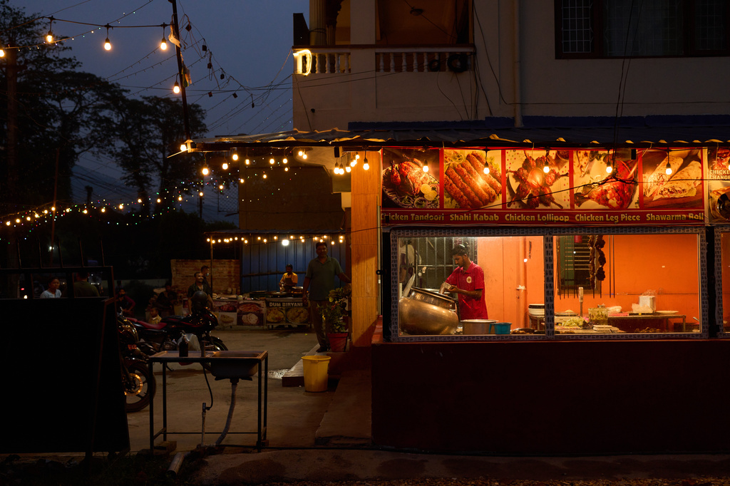 Dusk sets over a restaurant where transgender sex workers meet clients along a busy highway in Hetauda, Nepal, Wednesday, May 20, 2026. (AP Photo/Bram Janssen)