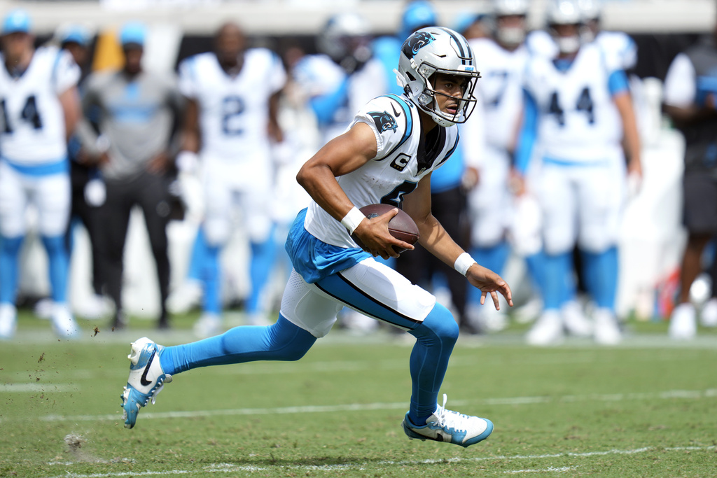 Carolina Panthers quarterback Bryce Young runs with the ball during the first half of an NFL football game against the Jacksonville Jaguars, Sunday, Sept. 7, 2025, in Jacksonville, Fla. (AP Photo/John Raoux)