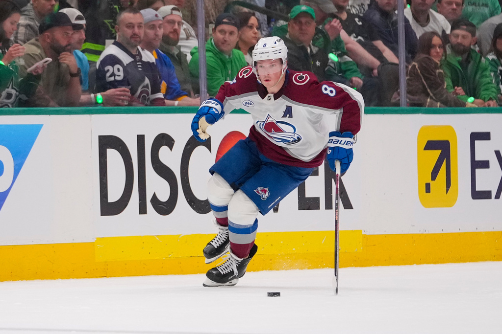 FILE - Colorado Avalanche defenseman Cale Makar (8) skates with the puck against the Dallas Stars during the second period in Game 2 of a first-round NHL hockey playoff series Monday, April 21, 2025, in Dallas. (AP Photo/Julio Cortez, File)