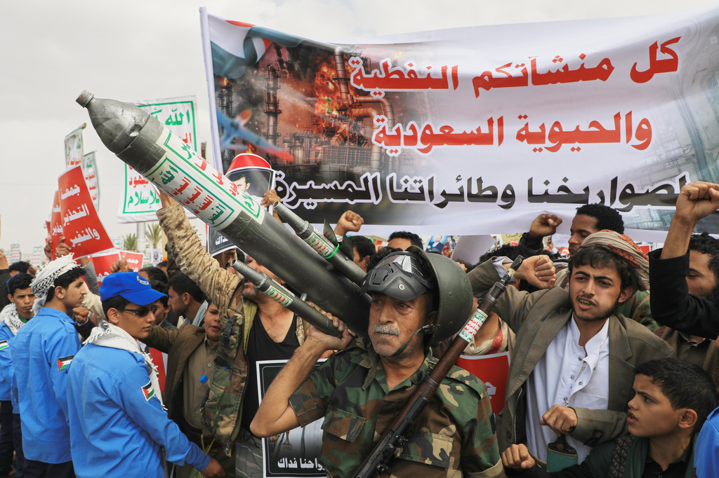 FILE - Houthi supporters hold a rally in Sanaa, Yemen, July 17, 2026, against the Saudi-led coalition. Banner in Arabic reads, "All Saudi oil facilities are targets to our missiles and drones." (AP Photo/Osamah Abdulrahman, File)