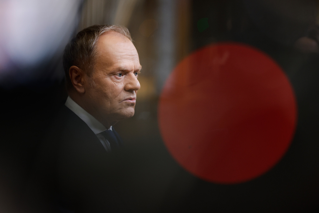 FILE - Poland's Prime Minister Donald Tusk speaks with the media as he arrives for the EU summit in Brussels, Jan. 22, 2026. (AP Photo/Geert Vanden Wijngaert, File)