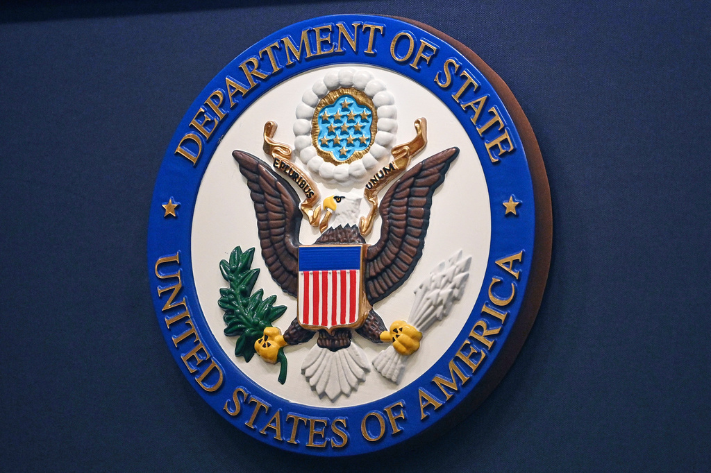 FILE - The State Department seal is seen on the briefing room lectern at the State Department in Washington, Jan. 31, 2022. (Mandel Ngan, Pool via AP, File)