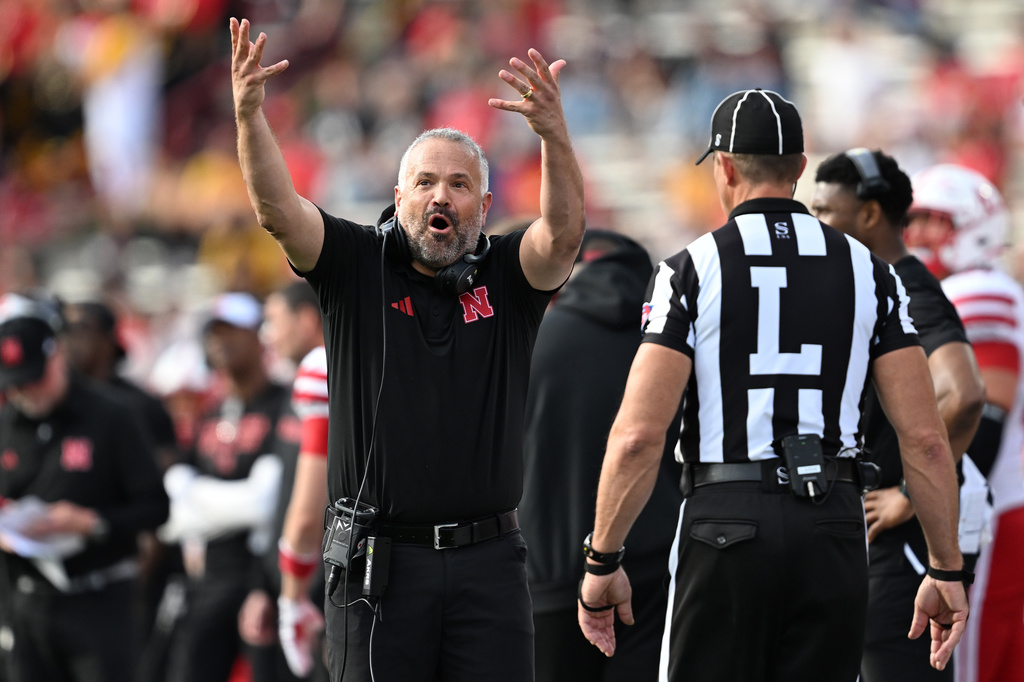 Nebraska head coach Matt Rhule talks with an official during the first half of a NCAA college football game, Saturday, Oct. 11, 2025, in College Park, Md. (AP Photo/Gail Burton)
