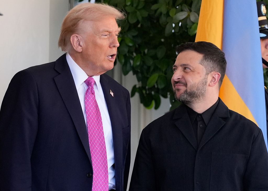 President Donald Trump, left, greets Ukraine's President Volodymyr Zelenskyy at the White House, Friday, Oct. 17, 2025, in Washington. (AP Photo/Alex Brandon)