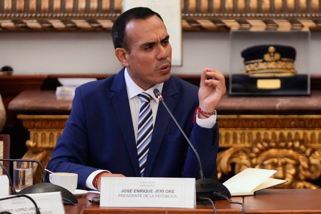 Peru's interim President Jose Jeri speaks to lawmakers at Congress in Lima, Peru, Wednesday, Jan. 21, 2026. (AP Photo/Martin Mejia)