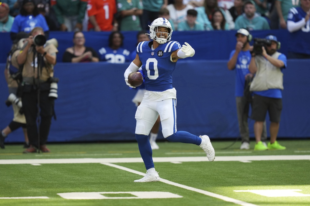 Indianapolis Colts safety Cam Bynum (0) celebrates an interception during the first half of an NFL football game against the Miami Dolphins on Sunday, Sept. 7, 2025, in Indianapolis. (AP Photo/Darron Cummings)