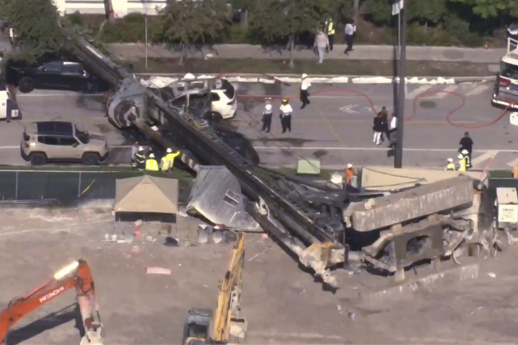 This image taken from a WSVN video shows Miami authorities responding to the scene of a crane that collapsed at a Miami construction site Monday, Sept. 14, 2026. (WSVN via AP)