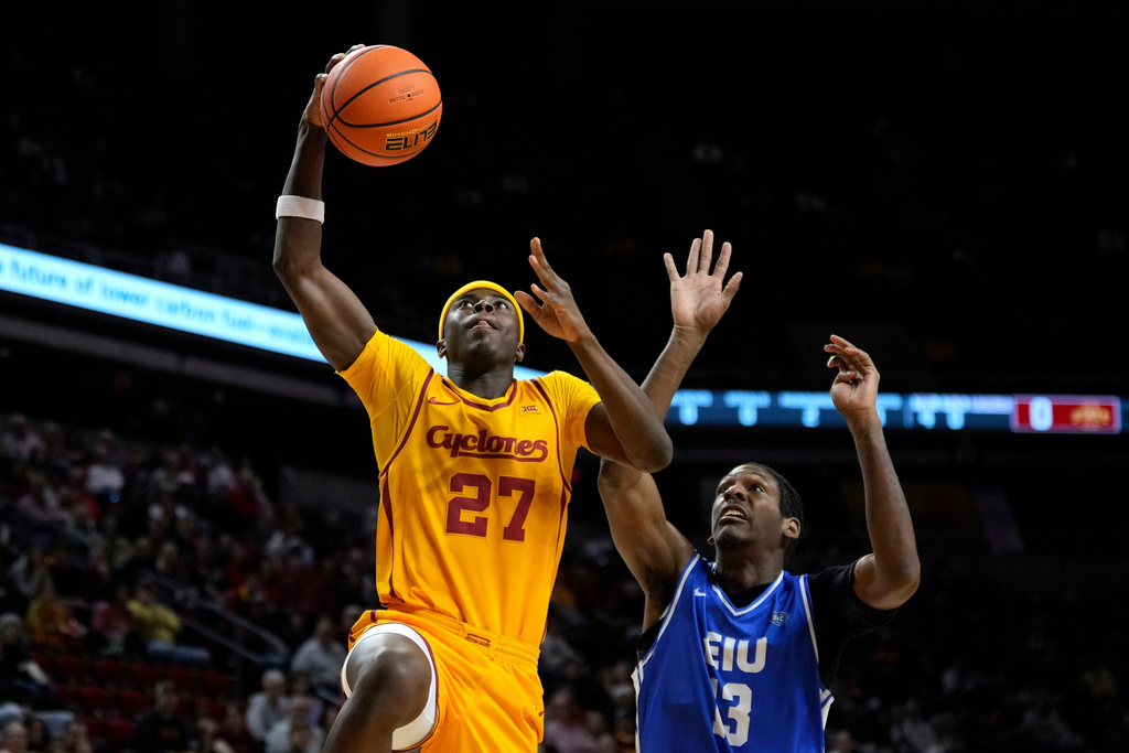 Iowa State guard Killyan Toure (27) drives to the basket past Eastern Illinois forward Nazareth Fisher (13) during the first half of an NCAA college basketball game, Sunday, Dec. 14, 2025, in Ames, Iowa. (AP Photo/Charlie Neibergall)