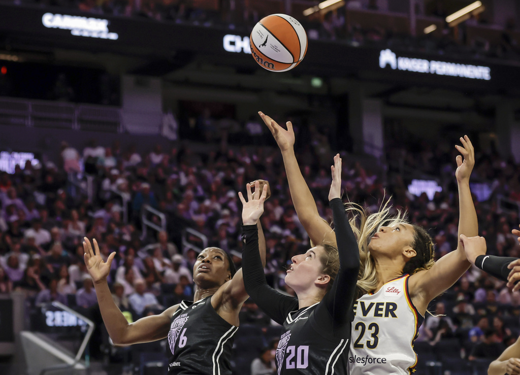 Golden State Valkyries' Kate Martin (20) and Kaila Charles (6) go up for a rebound against Indiana Fever's Aerial Powers (23) in the first half of a WNBA basketball game in San Francisco, Sunday, Aug. 31, 2025. (Carlos Avila Gonzalez/San Francisco Chronicle via AP)