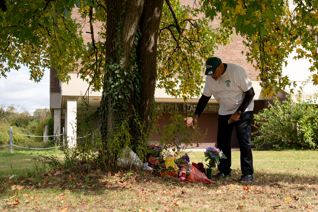 Rev. LeRoy West pays his respects to Kada Scott at a memorial near the abandoned Ada H. H. Lewis Middle School Monday, Oct. 20, 2025, in Philadelphia, where her body was found. (AP Photo/Mingson Lau)