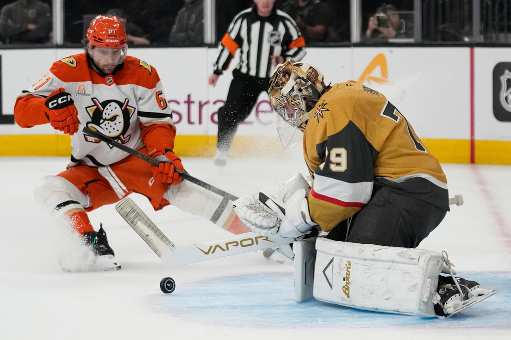 Vegas Golden Knights goaltender Carter Hart (79) stops a shot near Anaheim Ducks left wing Cutter Gauthier (61) during the first period of Game 2 of a second-round NHL hockey Stanley Cup playoff series Wednesday, May 6, 2026, in Las Vegas. (AP Photo/John Locher)
